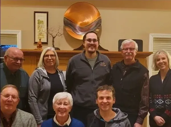 Group of people smiling indoors