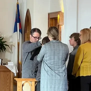 Family gathers in a church setting